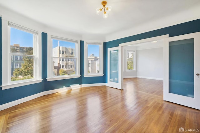 1930 Grove St Unit 4, San Francisco, CA 94117 - spare room with a chandelier and wood finished floors