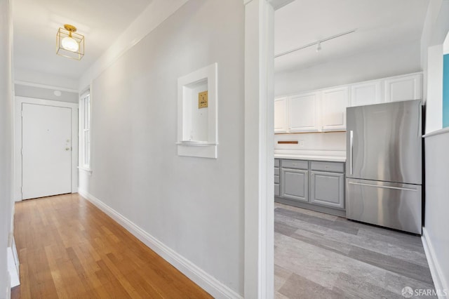 1930 Grove St Unit 4, San Francisco, CA 94117 - corridor with light wood-style flooring and rail lighting