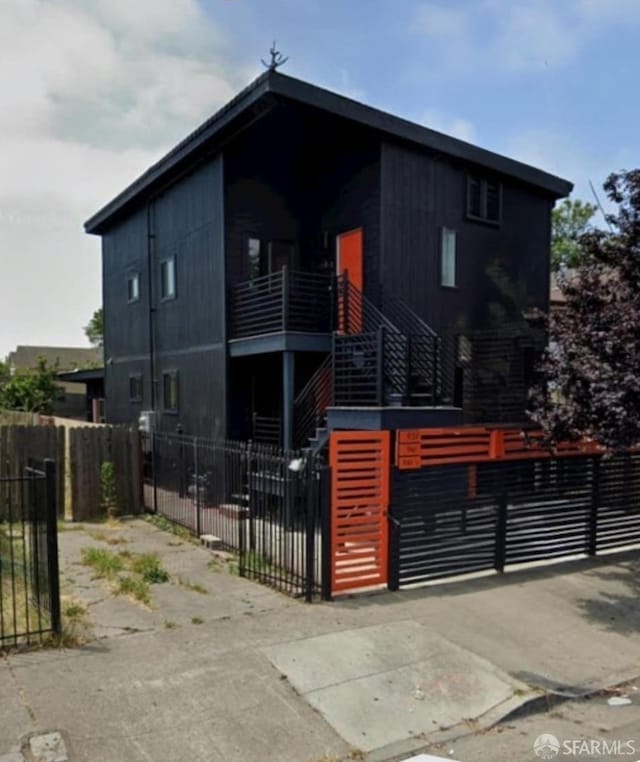 939-9411/2 26th St, Oakland, CA 94601 - view of front of house with stairs and a fenced front yard