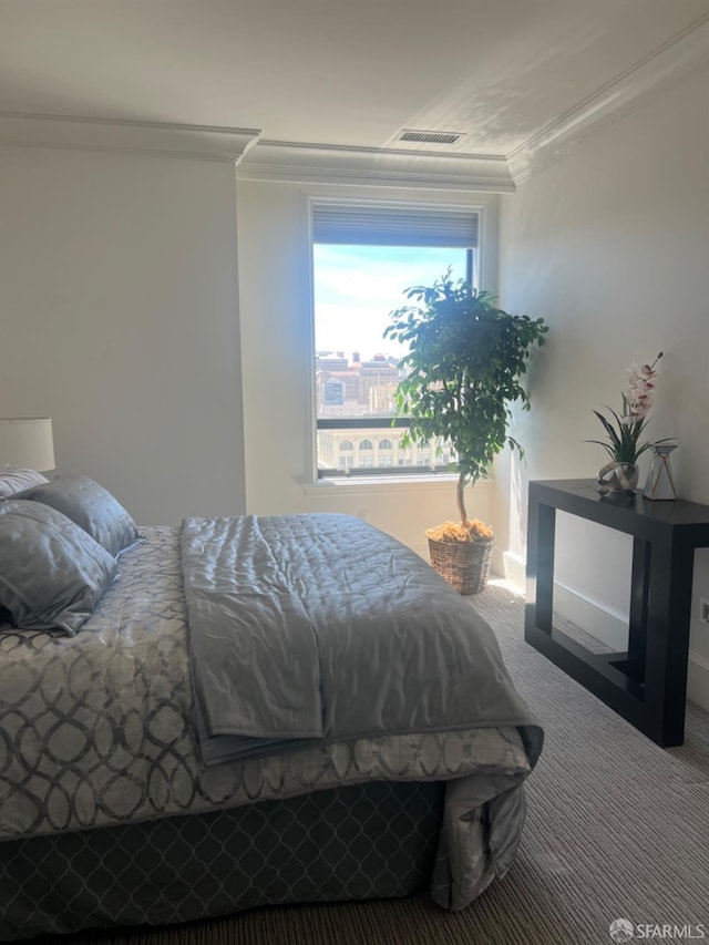 bedroom featuring carpet flooring and ornamental molding