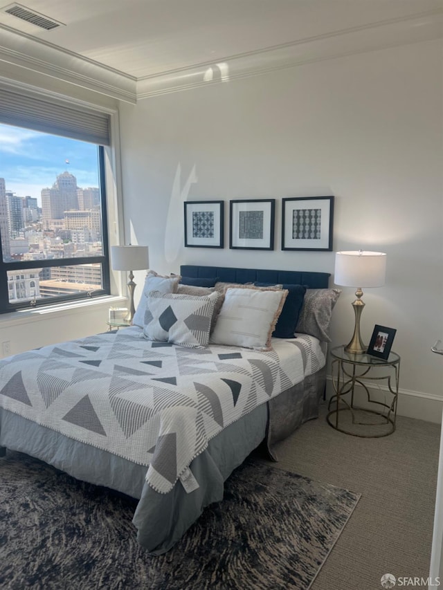 bedroom featuring carpet and ornamental molding