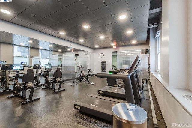 workout area with a drop ceiling