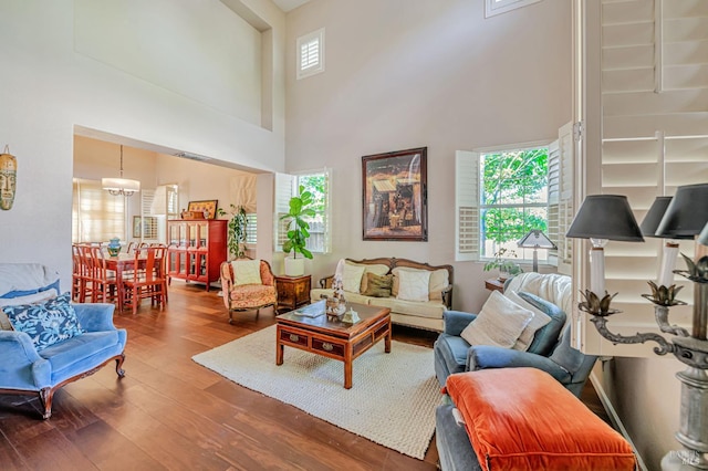 2035 Kirkwood Ct, Fairfield, CA 94534 - living room featuring a high ceiling, wood finished floors, and a chandelier