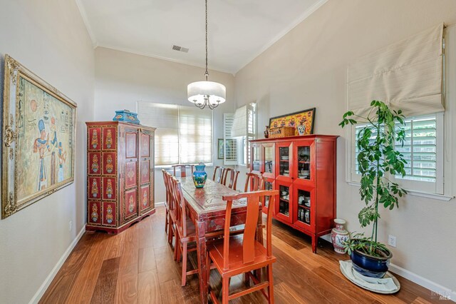 2035 Kirkwood Ct, Fairfield, CA 94534 - dining space featuring ornamental molding, wood finished floors, baseboards, and a chandelier