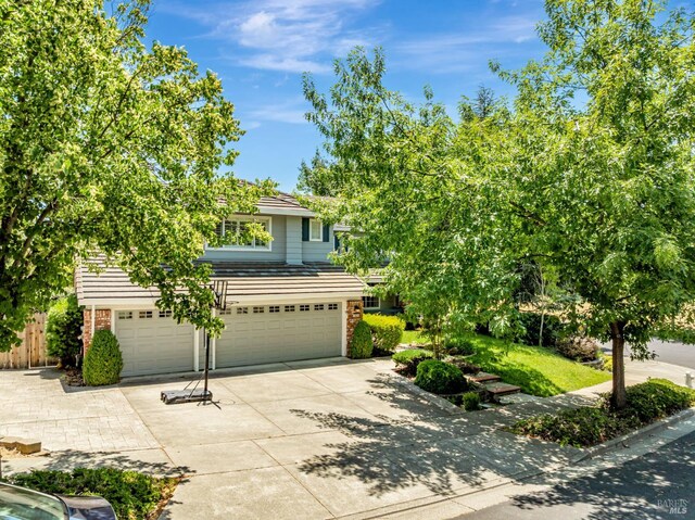 2035 Kirkwood Ct, Fairfield, CA 94534 - obstructed view of property with an attached garage, concrete driveway, and brick siding