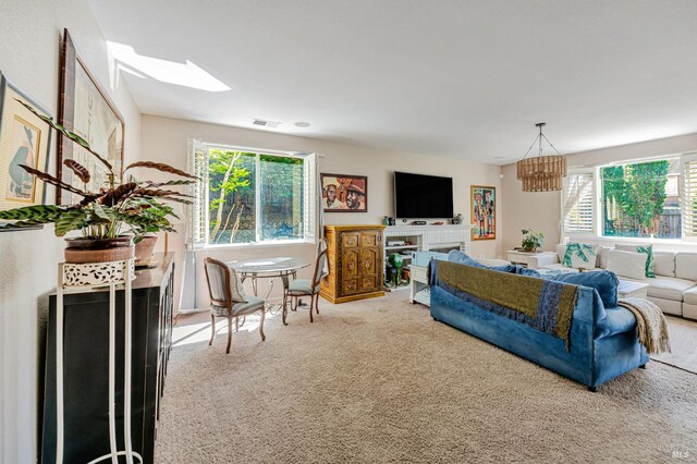 2035 Kirkwood Ct, Fairfield, CA 94534 - living room featuring carpet, plenty of natural light, a skylight, and a chandelier