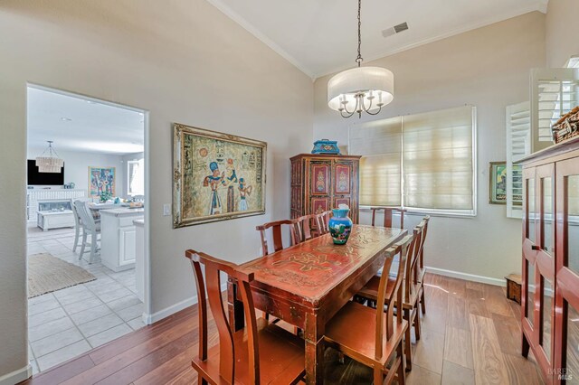 2035 Kirkwood Ct, Fairfield, CA 94534 - dining room featuring crown molding, a chandelier, wood finished floors, and baseboards