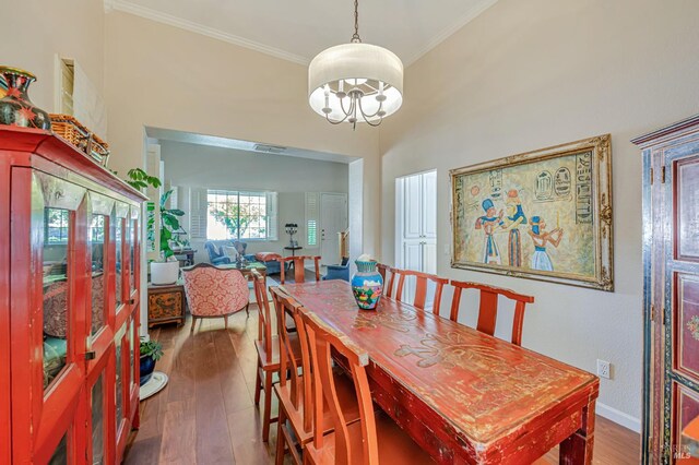 2035 Kirkwood Ct, Fairfield, CA 94534 - dining space with a chandelier, wood finished floors, crown molding, and baseboards