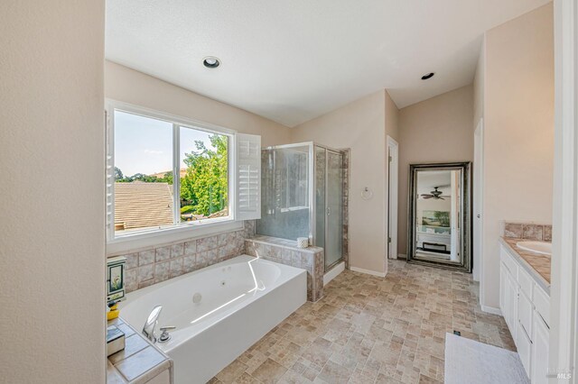 2035 Kirkwood Ct, Fairfield, CA 94534 - full bath featuring a shower stall, a tub with jets, vanity, and baseboards