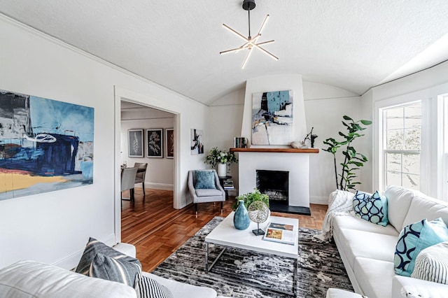 living area with baseboards, a fireplace with raised hearth, and lofted ceiling