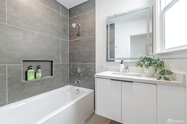 full bath featuring vanity and shower / bath combination