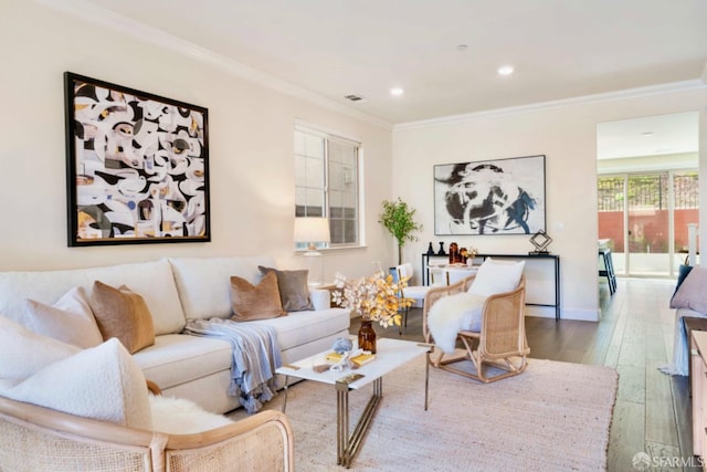 living room featuring wood-type flooring and crown molding