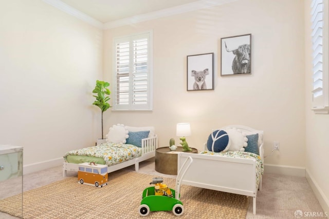 bedroom featuring ornamental molding and carpet floors