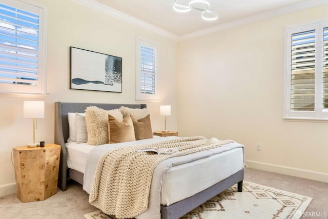 carpeted bedroom with ornamental molding