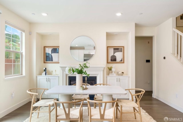 dining space featuring wood-type flooring