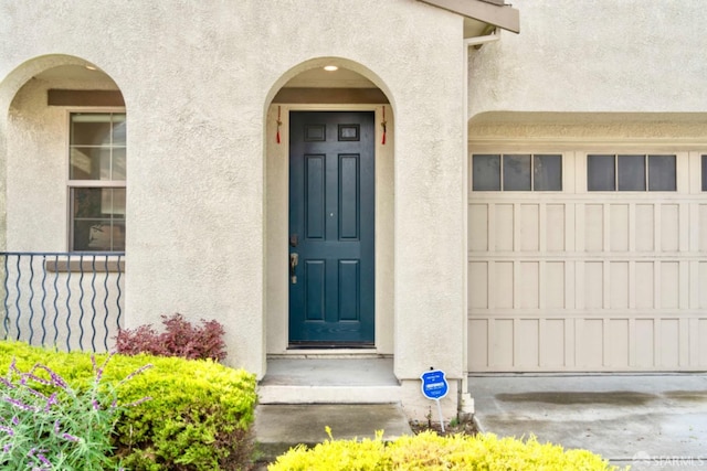 doorway to property featuring a garage