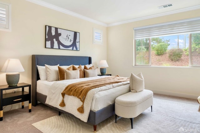 bedroom with crown molding and carpet floors