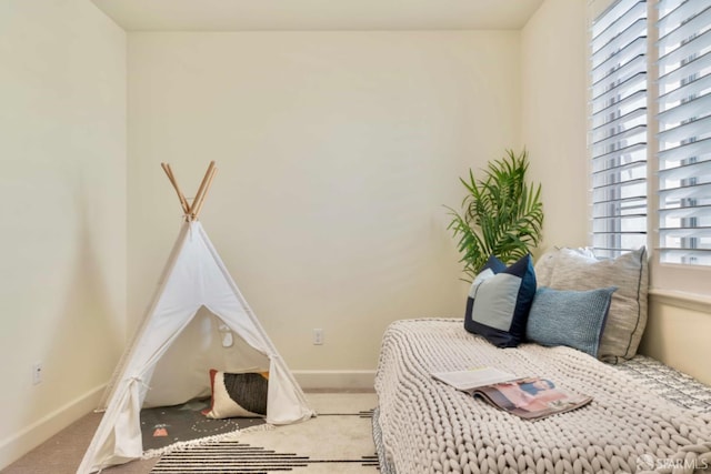 interior space featuring carpet flooring and a healthy amount of sunlight