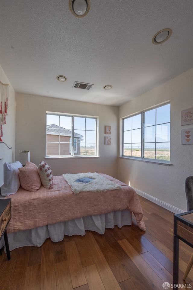 3044 Whisperwave Cir, Redwood City, CA 94065 - bedroom with wood finished floors, baseboards, a textured ceiling, and recessed lighting