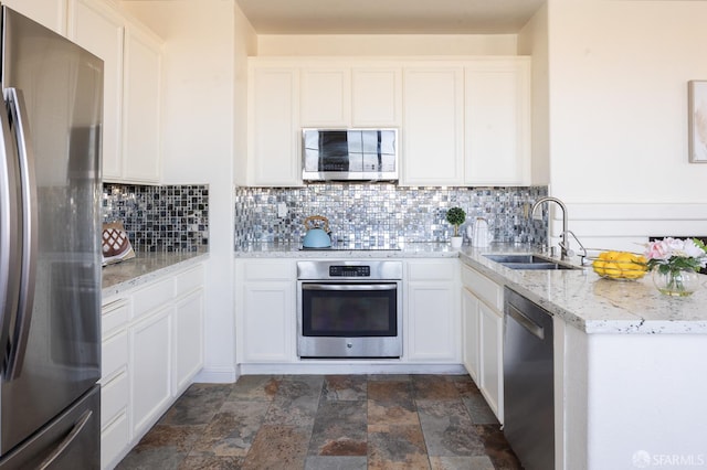 3044 Whisperwave Cir, Redwood City, CA 94065 - kitchen with appliances with stainless steel finishes, a sink, dark stone finish flooring, and decorative backsplash