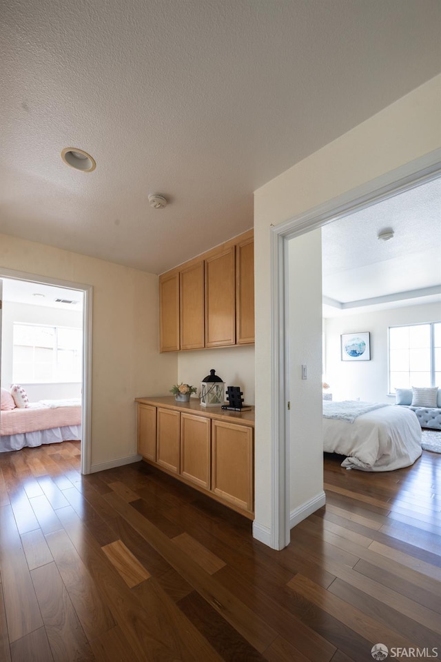 3044 Whisperwave Cir, Redwood City, CA 94065 - bar featuring dark wood-style flooring, a textured ceiling, and baseboards