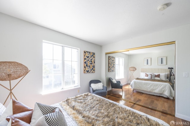 3044 Whisperwave Cir, Redwood City, CA 94065 - bedroom with wood finished floors, a closet, and baseboards
