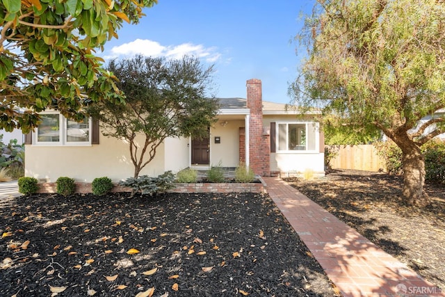 532 Vista Ct, Millbrae, CA 94030 - view of front of house featuring stucco siding and a chimney