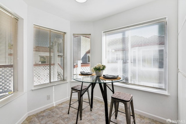 dining area with breakfast area and plenty of natural light