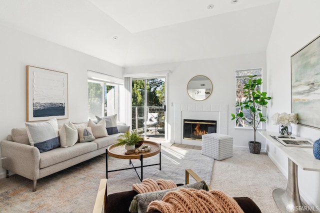 carpeted living room with vaulted ceiling