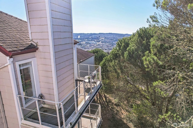 view of side of property with a balcony