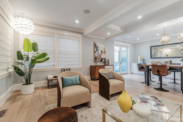 living room featuring a notable chandelier, beam ceiling, ornamental molding, and light hardwood / wood-style floors