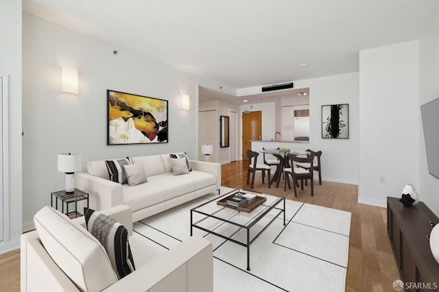 425 1st St Unit 3401, San Francisco, CA 94107 - living area featuring light wood finished floors and baseboards