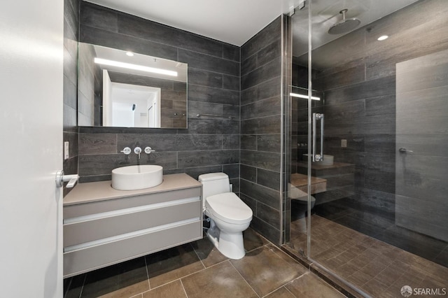 425 1st St Unit 3401, San Francisco, CA 94107 - full bathroom with a shower stall, vanity, toilet, tile walls, and tile patterned flooring
