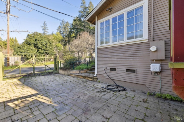 view of side of home featuring a patio area