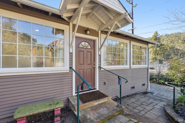 doorway to property with a patio