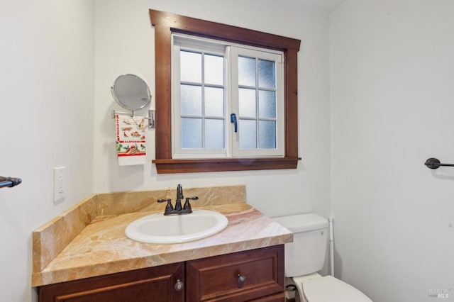 bathroom with vanity and toilet