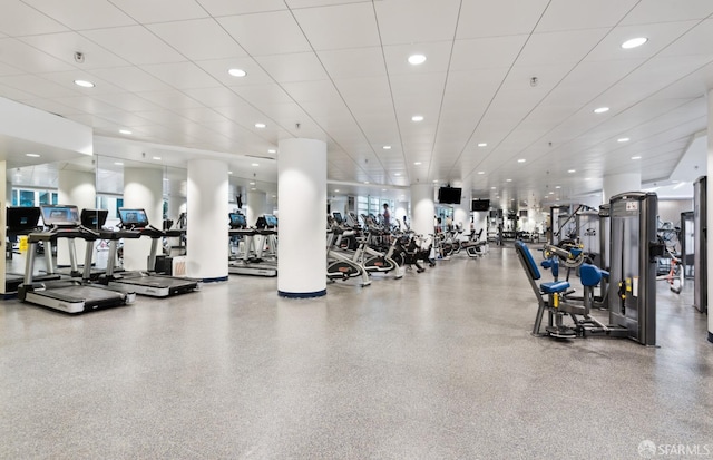 workout area featuring a drop ceiling and recessed lighting