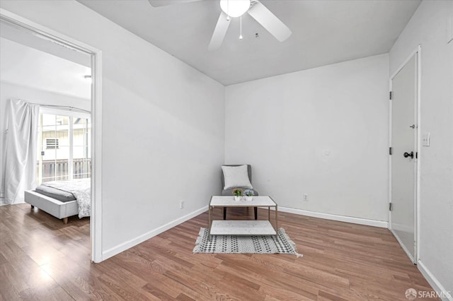 unfurnished room featuring ceiling fan and wood-type flooring