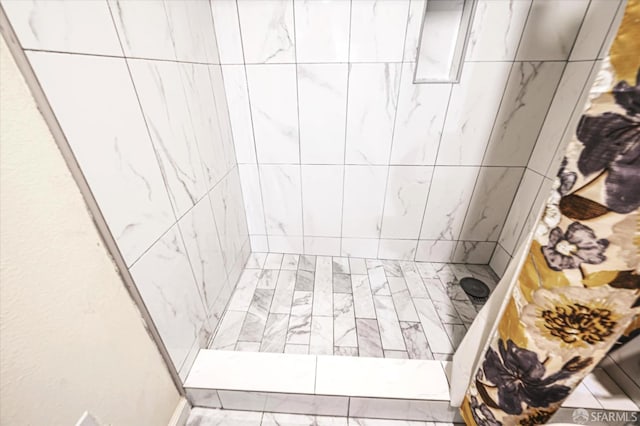 interior space with tiled shower