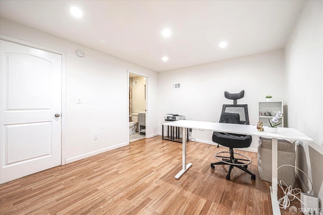 office space with hardwood / wood-style flooring