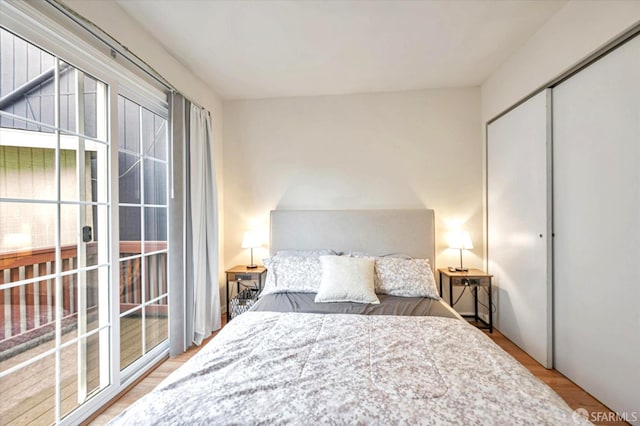 bedroom with a closet and light hardwood / wood-style flooring