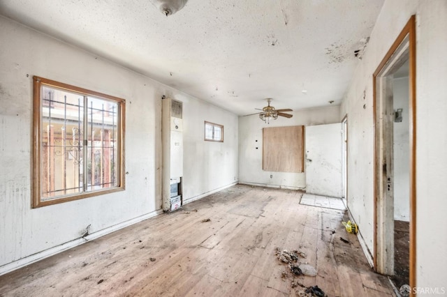 unfurnished room with ceiling fan