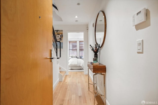 corridor with light hardwood / wood-style flooring