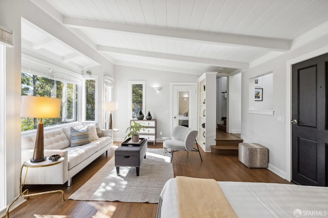 living room featuring lofted ceiling with beams and dark hardwood / wood-style flooring