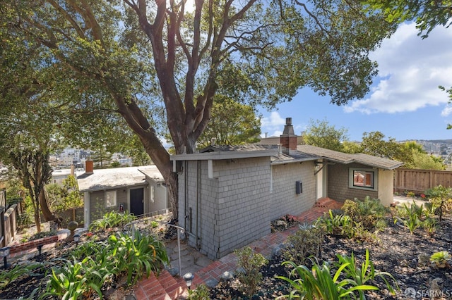 view of side of home with a patio area