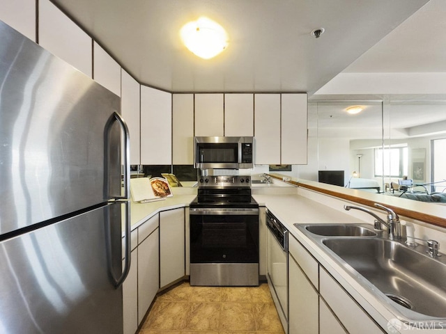 601 Van Ness Ave Unit 1047, San Francisco, CA 94102 - kitchen featuring stainless steel appliances, light countertops, and white cabinets