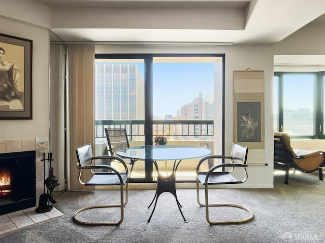 601 Van Ness Ave Unit 1047, San Francisco, CA 94102 - dining space featuring healthy amount of natural light, a tiled fireplace, carpet, and a view of city