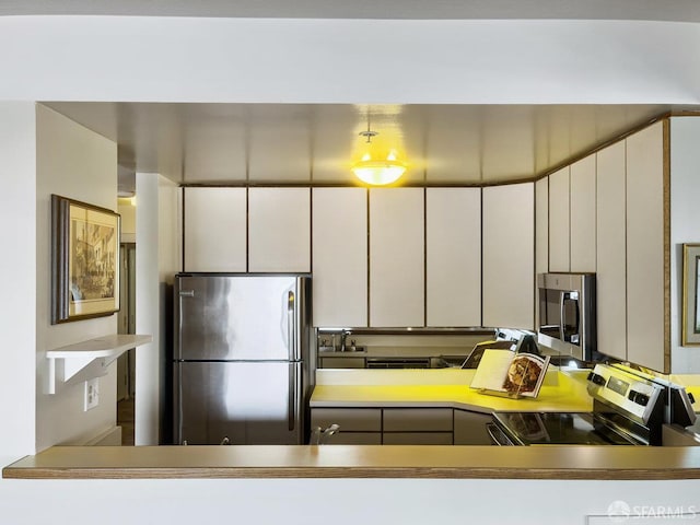 601 Van Ness Ave Unit 1047, San Francisco, CA 94102 - kitchen featuring appliances with stainless steel finishes and white cabinetry