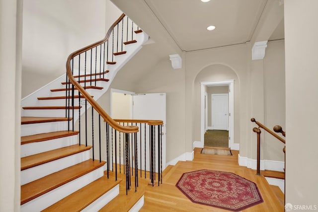 2108 Lakeshore Ave, Oakland, CA 94606 - staircase with wood finished floors, arched walkways, and recessed lighting