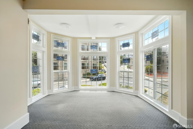 2108 Lakeshore Ave, Oakland, CA 94606 - unfurnished sunroom with carpet flooring and baseboards